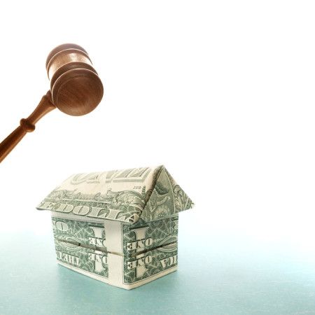 gavel and a house made of money