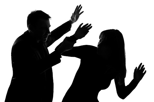 Silhouettes of a man and woman fighting. Understanding domestic violence myths may help to evaluate a domestic violence case.